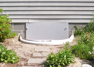 Rigid plastic crawl space access well installed in a Sylva crawl space
