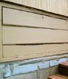 an old-fashioned crawl space door in Scaly Mountain about to be replaced