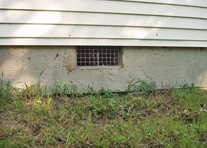 Open crawl space vents that let rodents, termites, and other pests in a home in Rosman