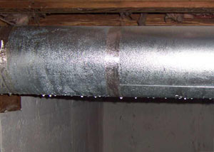 condensation collecting on an HVAC vent in a humid Penrose basement
